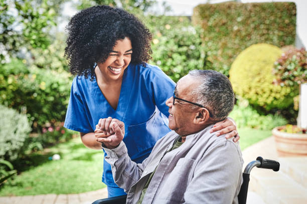 Caregiver helping senior with mobility